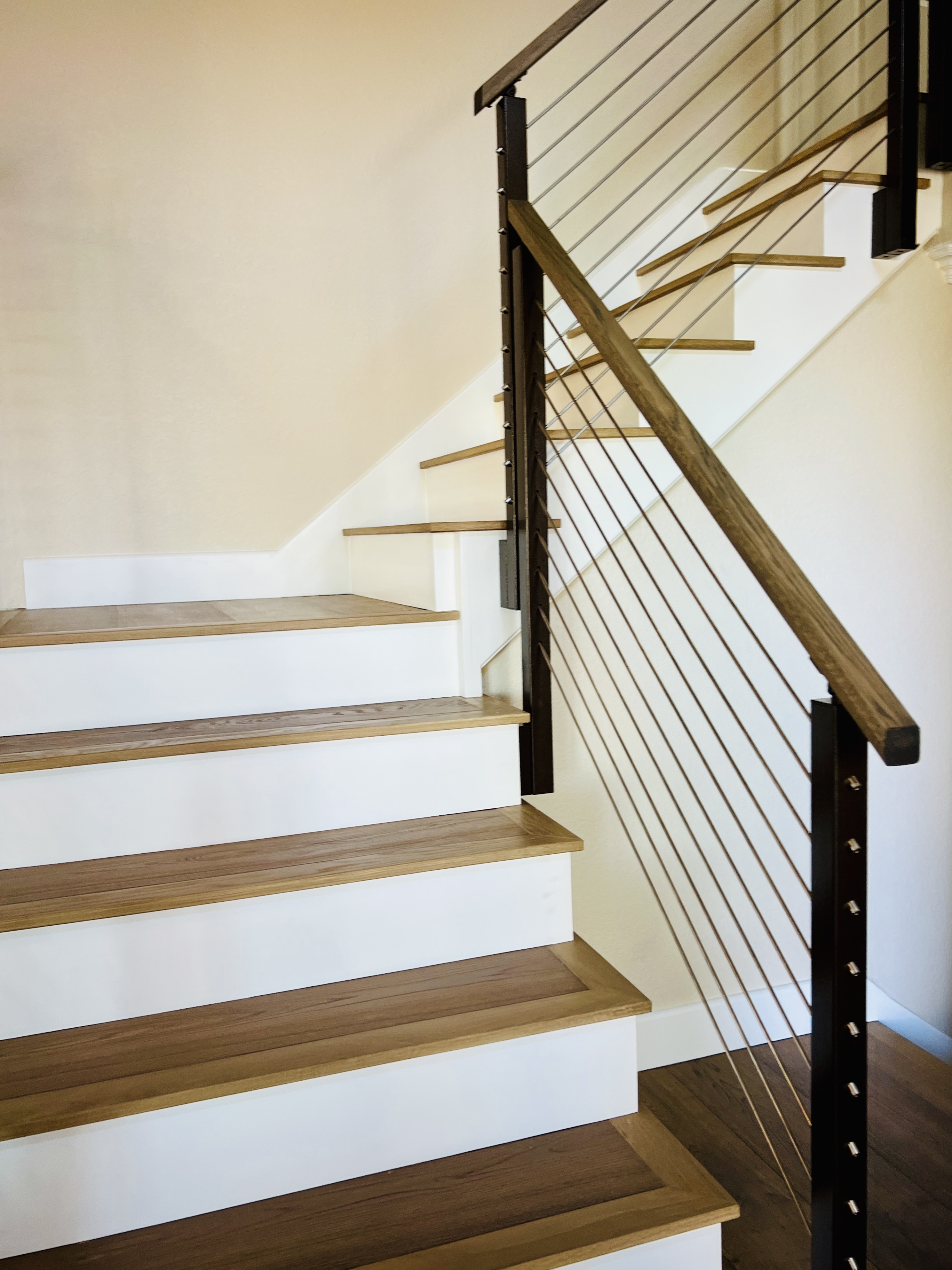 Rod On Railing Side-mounted Post Rod Railing on a Staircase | Vantage Stairs & Railing
