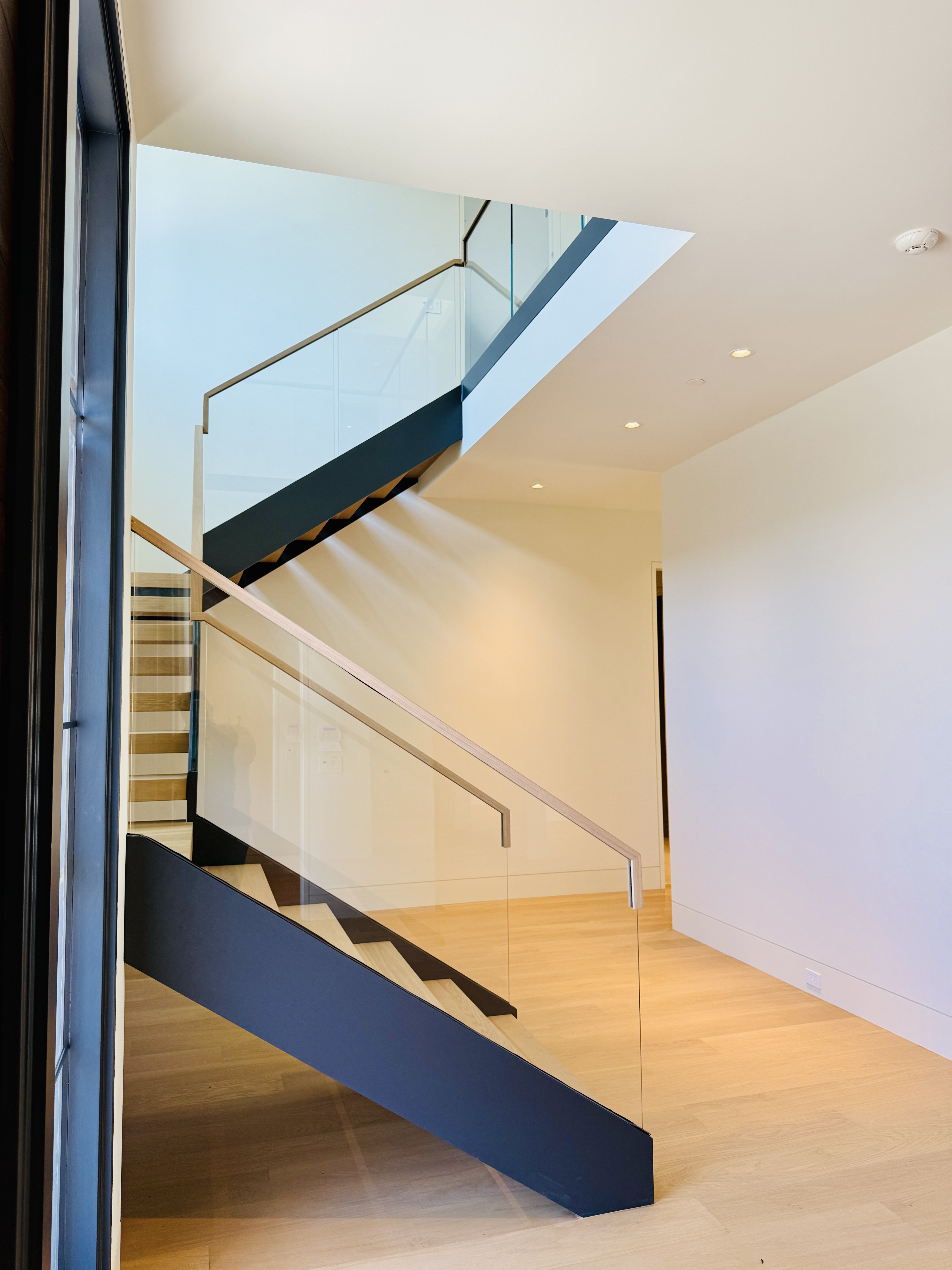Top Cap Railing Glass Railing with Continuous white oak top cap | Vantage Stairs & Railing